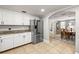 Stylish kitchen featuring stainless steel refrigerator, granite counters and view to dining room at 7425 Terrace River Dr, Temple Terrace, FL 33637