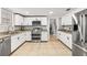 Modern kitchen featuring stainless steel appliances, bright cabinets, and granite counters at 7425 Terrace River Dr, Temple Terrace, FL 33637