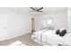 Bright bedroom with a ceiling fan, a mirror sliding door closet, and modern vinyl flooring at 800 51St S St, Gulfport, FL 33707