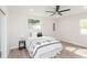 Bright bedroom with ceiling fan, wood-look floors, and modern decor at 800 51St S St, Gulfport, FL 33707