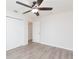 Bedroom featuring a ceiling fan, light wood flooring, and closet at 800 51St S St, Gulfport, FL 33707