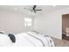 Bright bedroom with white walls, ceiling fan, and modern decor at 800 51St S St, Gulfport, FL 33707