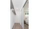Walk-in closet with sliding door and built in shelving, wood-look flooring at 800 51St S St, Gulfport, FL 33707