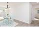 Cozy dining room with wood floors, a chandelier, and seating for four at 800 51St S St, Gulfport, FL 33707