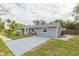 Well-kept home with a spacious driveway and manicured landscaping at 800 51St S St, Gulfport, FL 33707