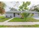 Inviting home featuring a well-manicured lawn and a freshly painted exterior at 800 51St S St, Gulfport, FL 33707