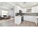 Kitchen and living room combo with modern cabinets, stainless appliances, and an open floor plan at 800 51St S St, Gulfport, FL 33707