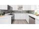 Bright kitchen with stainless steel appliances, modern cabinets, and ample counter space at 800 51St S St, Gulfport, FL 33707