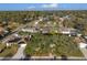An aerial view shows this residential neighborhood with mature trees, well-maintained homes and a pleasant Florida lifestyle at 8083 Bayhaven Dr, Seminole, FL 33776