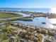 An aerial view shows this neighborhood's proximity to the inter-coastal waterway, beach and beautiful blue water at 8083 Bayhaven Dr, Seminole, FL 33776