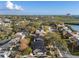 Scenic aerial view of a residential neighborhood close to the river and highway, featuring mature trees and private homes at 8083 Bayhaven Dr, Seminole, FL 33776