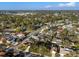 Aerial view of a sprawling neighborhood with large trees, sidewalks, and well-maintained homes offering a peaceful and welcoming community at 8083 Bayhaven Dr, Seminole, FL 33776