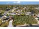 An aerial view shows this residential neighborhood with mature trees, well-maintained homes and a pleasant Florida lifestyle at 8083 Bayhaven Dr, Seminole, FL 33776