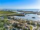 Aerial view of a picturesque waterfront neighborhood, displaying homes and proximity to the water at 8083 Bayhaven Dr, Seminole, FL 33776