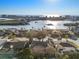Aerial view showcases this waterfront neighborhood and a beautiful, clear view of the inter-coastal waterway and beaches at 8083 Bayhaven Dr, Seminole, FL 33776