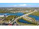 A picturesque aerial view captures the intercoastal waterway, bridges, and lush surroundings of this charming coastal community at 8083 Bayhaven Dr, Seminole, FL 33776