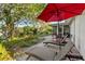 Inviting backyard with a brick patio, lounge chairs, and view of the home's screened patio at 8083 Bayhaven Dr, Seminole, FL 33776