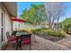 Beautifully landscaped backyard with a brick paver patio, perfect for outdoor dining and relaxation at 8083 Bayhaven Dr, Seminole, FL 33776
