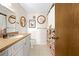 Bathroom showcasing a stylish vanity, decorative mirrors, and a patterned shower curtain at 8083 Bayhaven Dr, Seminole, FL 33776