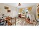 Charming bedroom with a crib, tent, and ample natural light at 8083 Bayhaven Dr, Seminole, FL 33776