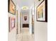 Hallway featuring tile floors and art displayed on the walls at 8083 Bayhaven Dr, Seminole, FL 33776