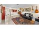 Bright living room with an eye-catching rug, comfortable seating, and neutral walls at 8083 Bayhaven Dr, Seminole, FL 33776