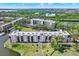 Scenic aerial view of a condominium complex surrounded by lush greenery and waterway views at 8174 Terrace Garden N Dr # 410, St Petersburg, FL 33709