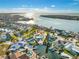An aerial view shows a waterfront house with a private dock, swimming pool, and attractive landscaping at 1029 Bal Harbour Dr, Apollo Beach, FL 33572