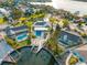 Stunning aerial view of waterfront property with pool, dock, and lush landscaping, perfect for serene coastal living at 1029 Bal Harbour Dr, Apollo Beach, FL 33572