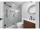 Contemporary bathroom featuring glass shower and stylish wood vanity at 1029 Bal Harbour Dr, Apollo Beach, FL 33572