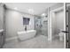 Modern bathroom featuring a freestanding tub, walk-in shower, and contemporary fixtures at 1029 Bal Harbour Dr, Apollo Beach, FL 33572