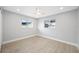 Bedroom with lots of light, ceiling fan, wood-look floors, and neutral color palette at 1029 Bal Harbour Dr, Apollo Beach, FL 33572