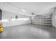 Well-lit, spacious two-car garage with a gray epoxy floor, providing ample parking at 1029 Bal Harbour Dr, Apollo Beach, FL 33572