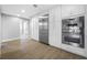 Gleaming kitchen with stainless steel refrigerator, double ovens, and ample white cabinets at 1029 Bal Harbour Dr, Apollo Beach, FL 33572