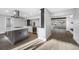 Bright, open kitchen with modern island, stainless steel appliances, and sleek cabinetry at 1029 Bal Harbour Dr, Apollo Beach, FL 33572