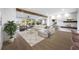 Spacious living room featuring exposed beams, comfortable seating, and water views at 1029 Bal Harbour Dr, Apollo Beach, FL 33572