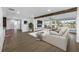 Relaxing living room with fireplace, shiplap wall, comfortable seating, and water views at 1029 Bal Harbour Dr, Apollo Beach, FL 33572