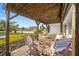 Inviting covered patio with brick flooring and outdoor seating area, perfect for relaxing and enjoying the neighborhood view at 1029 Bal Harbour Dr, Apollo Beach, FL 33572