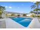 Beautiful backyard pool with covered patio and ample seating area perfect for entertaining at 1029 Bal Harbour Dr, Apollo Beach, FL 33572