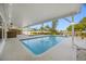 Covered patio overlooking the pool and waterway beyond at 1029 Bal Harbour Dr, Apollo Beach, FL 33572