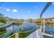 Scenic waterfront view with a dock, canal and clear skies, creating a relaxing outdoor atmosphere at 1029 Bal Harbour Dr, Apollo Beach, FL 33572