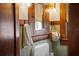 Bathroom vanity with wood trim, a vintage medicine cabinet, and a small towel at 109 E Woodlawn Ave, Tampa, FL 33603