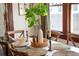 Close-up of a dining table with seating for six, decorative centerpiece, and natural light at 109 E Woodlawn Ave, Tampa, FL 33603