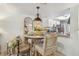 Dining area featuring a round table with seating for four and views to bright kitchen with stainless appliances at 110 Woods Landing Trl, Oldsmar, FL 34677