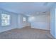 Spacious upstairs bedroom showcasing neutral paint and natural light from a window, offering versatile layout options at 11117 Abaco Island Ave, Riverview, FL 33579