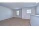 Upstairs bedroom showcasing neutral paint and natural light from a window, creating a bright and airy space at 11117 Abaco Island Ave, Riverview, FL 33579