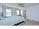 This bedroom features a ceiling fan, and plenty of natural light at 11117 Abaco Island Ave, Riverview, FL 33579