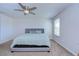 This bedroom features a ceiling fan, window and plush carpeting at 11117 Abaco Island Ave, Riverview, FL 33579
