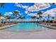 Inviting community pool featuring lounge areas, umbrellas, and a splash pad, creating a perfect spot for relaxation and recreation at 11117 Abaco Island Ave, Riverview, FL 33579