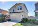 Two-story home with an attached two-car garage, a driveway and a well-maintained lawn at 11117 Abaco Island Ave, Riverview, FL 33579